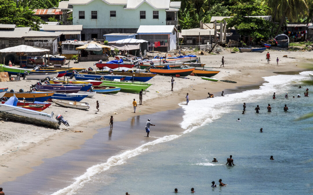 Gouave Beach, Grenada with fishing village and colorful fishing boats.